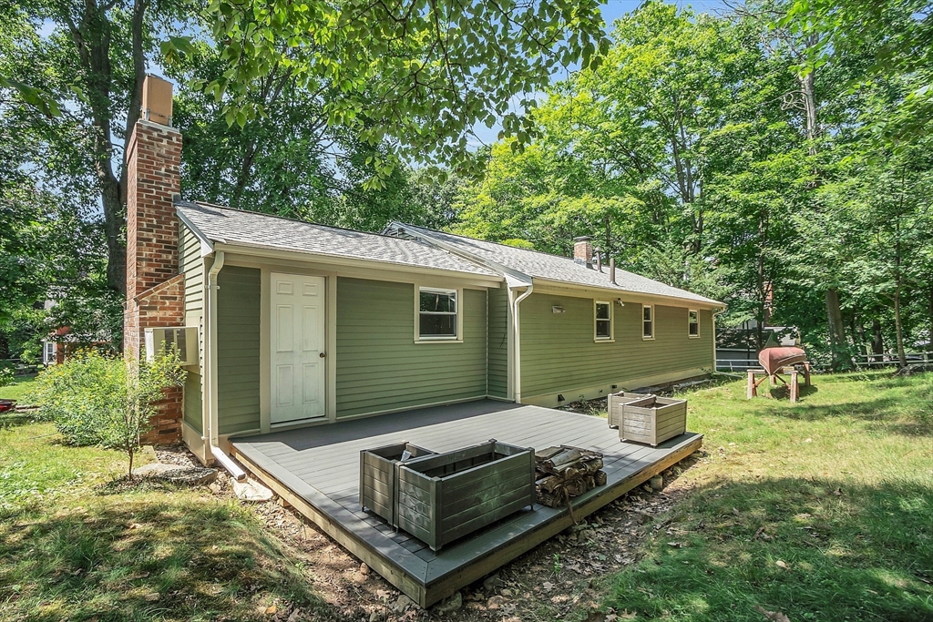 36 Mill Street Maynard, MA 01754 - Photo 35 of 42 a front view of a house with garden
