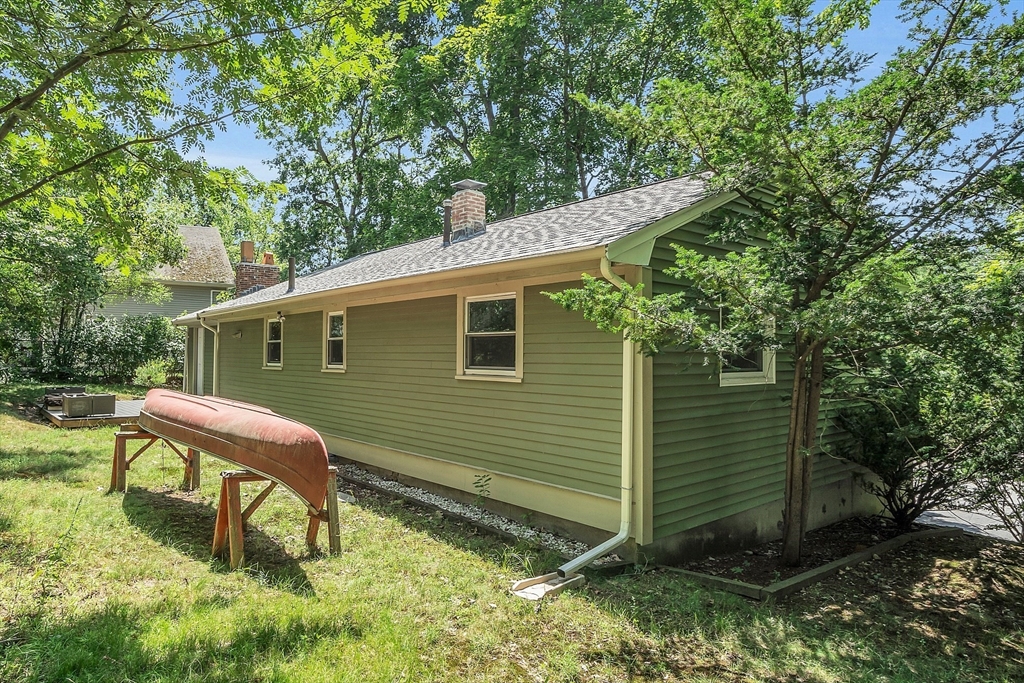 36 Mill Street Maynard, MA 01754 - Photo 37 of 42 a backyard of a house with table and chairs