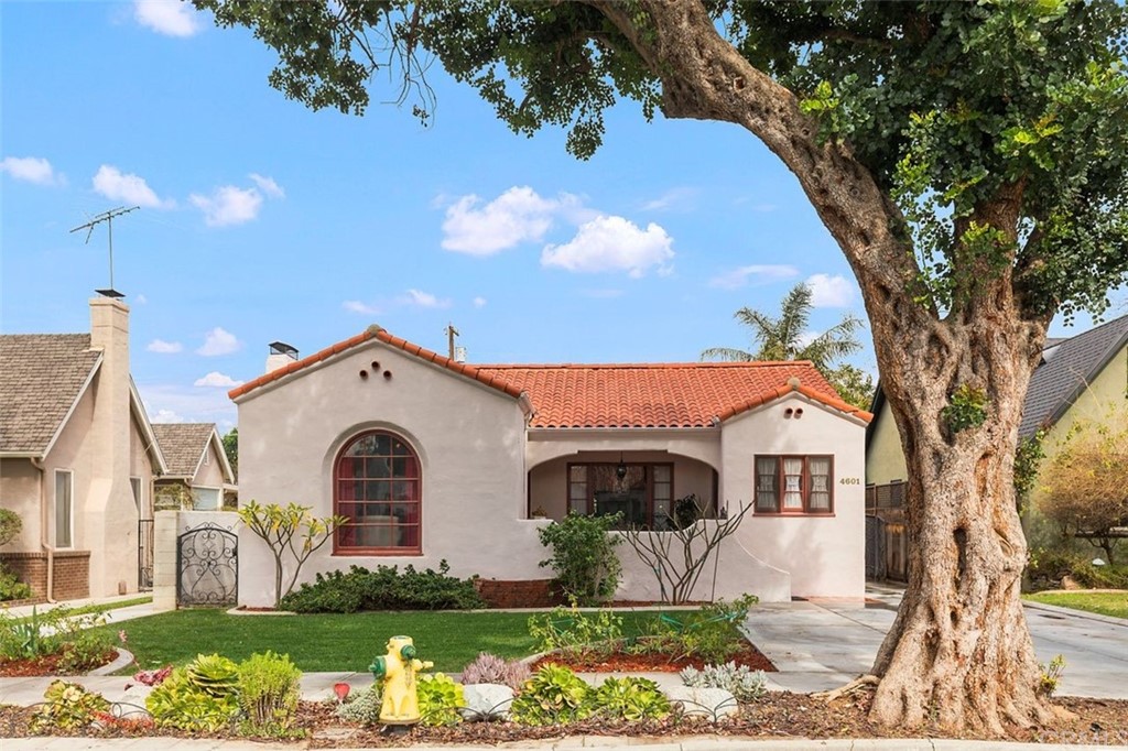 4601 Merrill Avenue Riverside, CA 92506 - Photo 1 of 1 a front view of a house with a yard