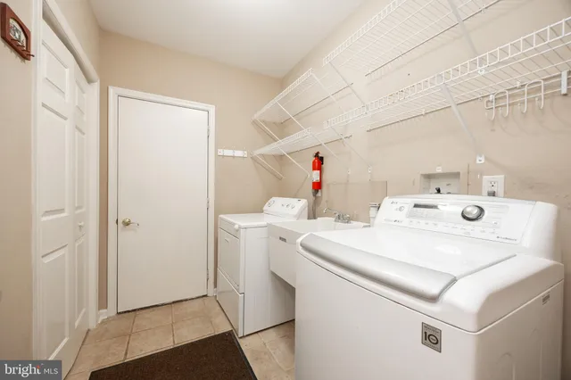 a bathroom with a sink toilet and mirror