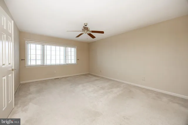 a view of a hallway with closet