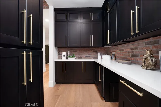 a kitchen with a sink and cabinets