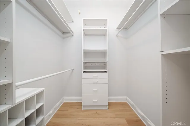 a view of an empty walk in closet