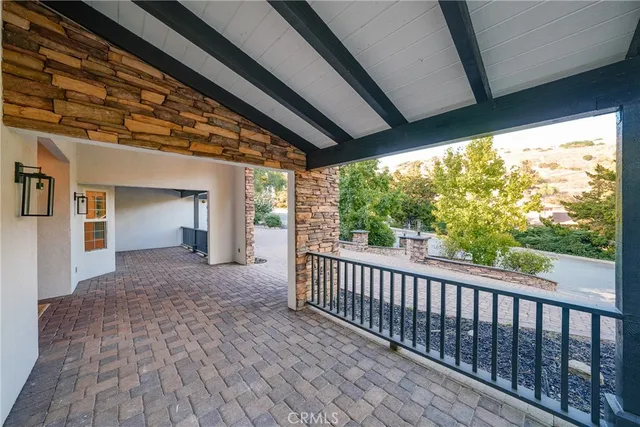 a view of a house with a yard and porch