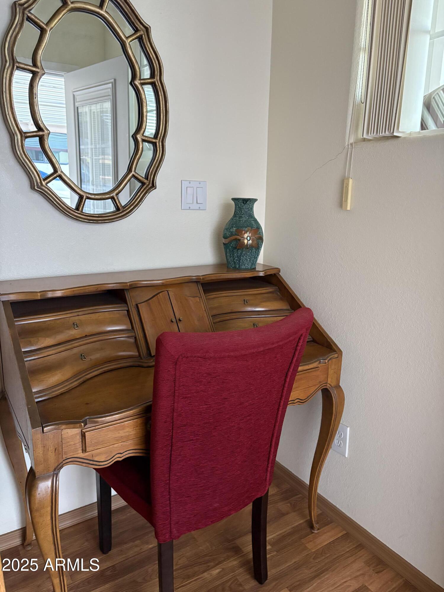 7750 East Broadway Road, Unit 604 Mesa, AZ 85208 - Photo 4 of 11 a view of livingroom with furniture and wooden floor