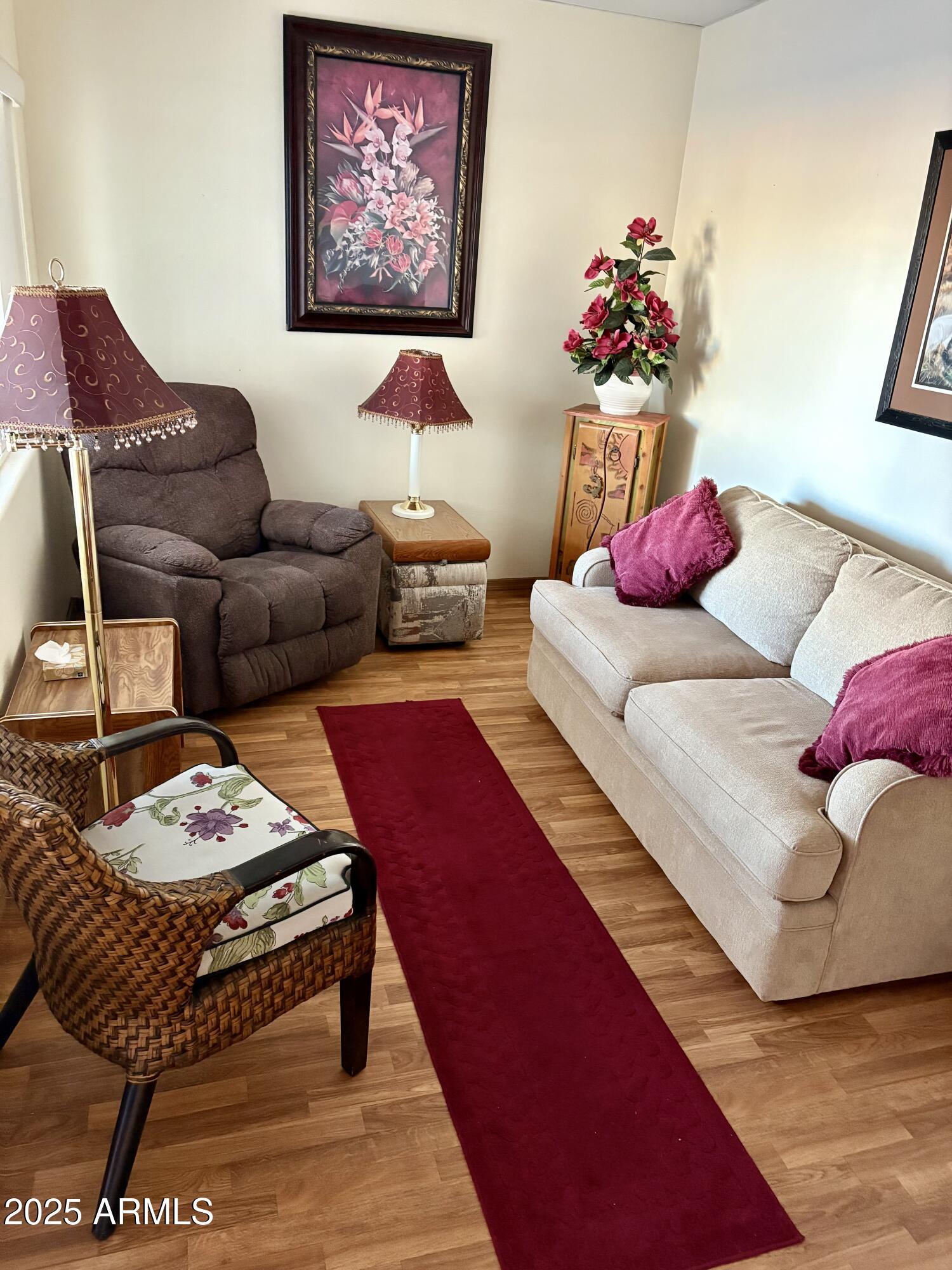 7750 East Broadway Road, Unit 604 Mesa, AZ 85208 - Photo 5 of 11 a living room with furniture and a couch