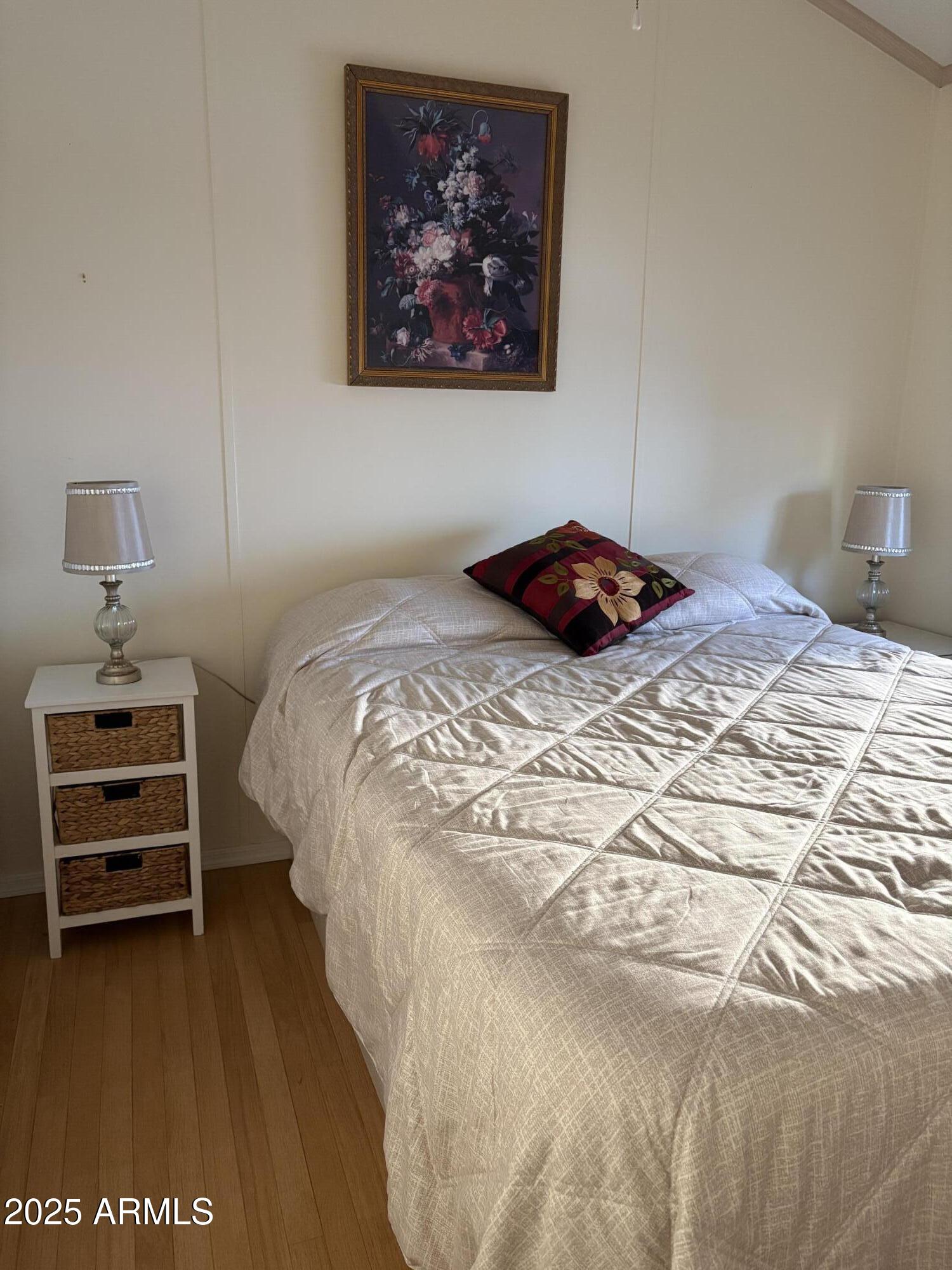 7750 East Broadway Road, Unit 604 Mesa, AZ 85208 - Photo 7 of 11 a bedroom with a bed and a cabinets