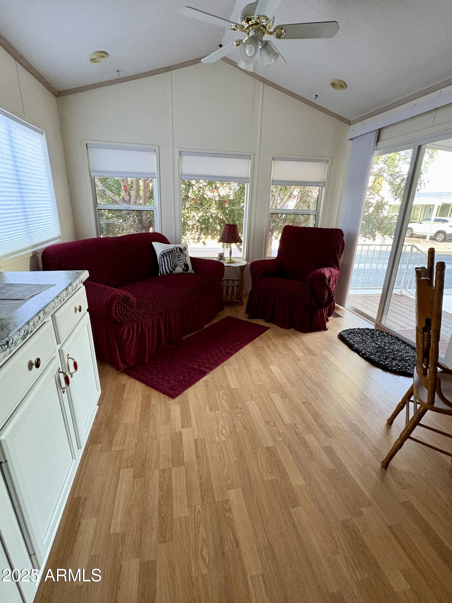 7750 East Broadway Road, Unit 604 Mesa, AZ 85208 - Photo 8 of 11 a living room with furniture and a large window
