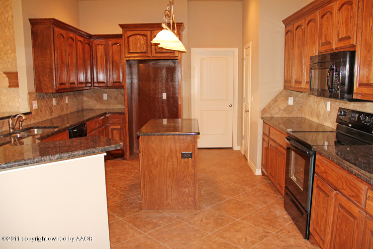 18451 Grasslands Road Bushland, TX 79124 - Photo 11 of 39 a view of a kitchen with a sink