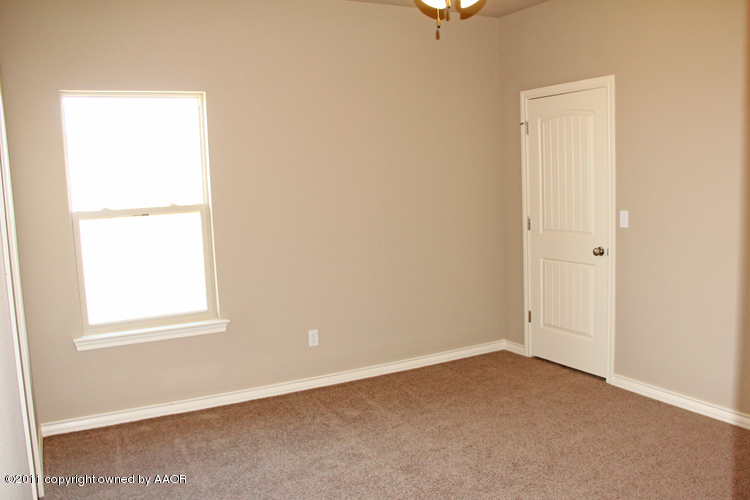 18451 Grasslands Road Bushland, TX 79124 - Photo 22 of 39 an empty room with windows and closet