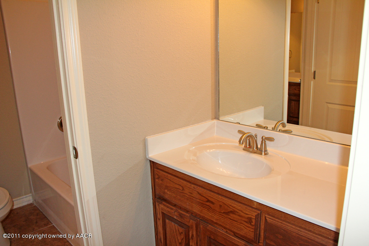18451 Grasslands Road Bushland, TX 79124 - Photo 31 of 39 a bathroom with a sink and a mirror