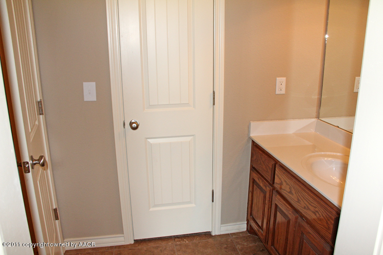 18451 Grasslands Road Bushland, TX 79124 - Photo 34 of 39 a bathroom with a sink and mirror