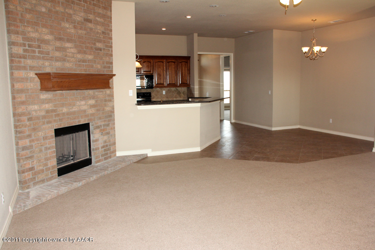 18451 Grasslands Road Bushland, TX 79124 - Photo 4 of 39 a view of kitchen and fireplace