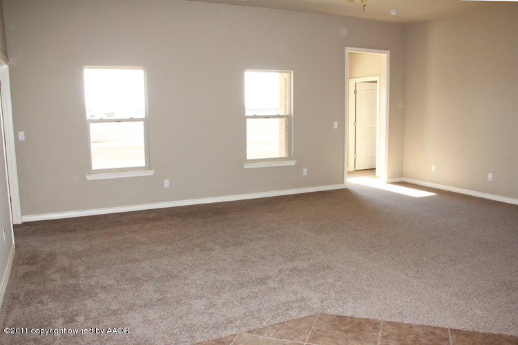 18451 Grasslands Road Bushland, TX 79124 - Photo 5 of 39 an empty room with windows