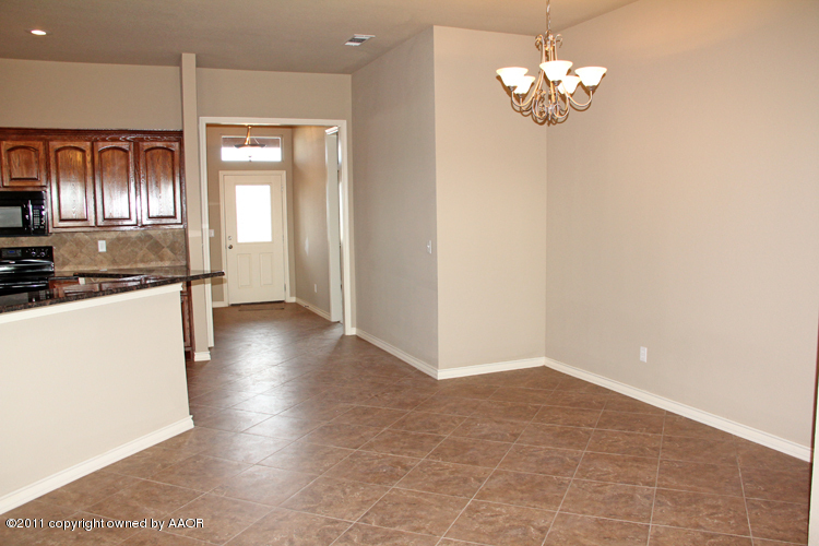 18451 Grasslands Road Bushland, TX 79124 - Photo 8 of 39 a view of a livingroom with a chandelier