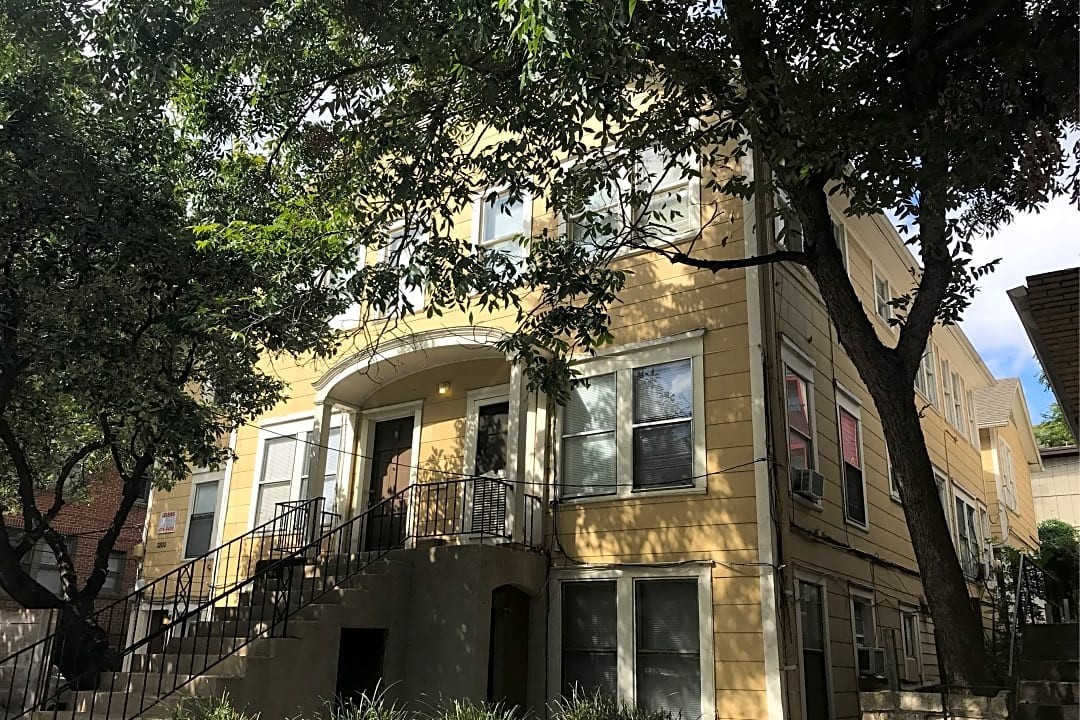2800 Whitis Avenue, Unit D Austin, TX 78705 - Photo 1 of 3 a front view of a residential apartment building with a tree