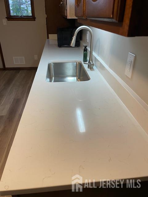 55 Murdock Street Fords, NJ 08863 - Photo 11 of 42 a kitchen with a sink and a refrigerator
