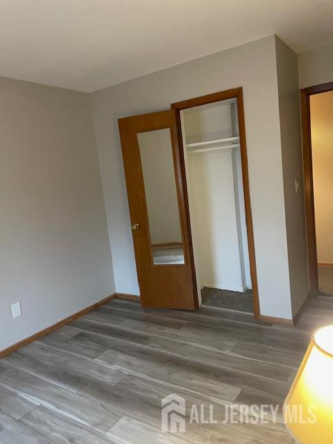 55 Murdock Street Fords, NJ 08863 - Photo 14 of 42 a view of an empty room with wooden floor and a window