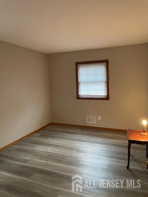 55 Murdock Street Fords, NJ 08863 - Photo 16 of 42 a view of an empty room with wooden floor and a window