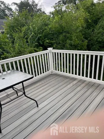 a balcony with wooden floor