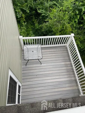 a view of a balcony with furniture