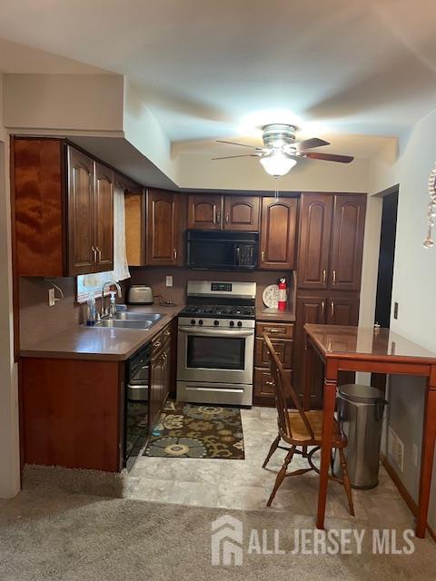 55 Murdock Street Fords, NJ 08863 - Photo 23 of 42 a kitchen with kitchen island granite countertop a stove a sink and a microwave