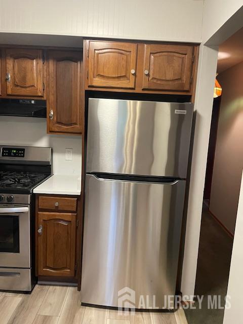 55 Murdock Street Fords, NJ 08863 - Photo 25 of 42 a kitchen with a refrigerator and a stove