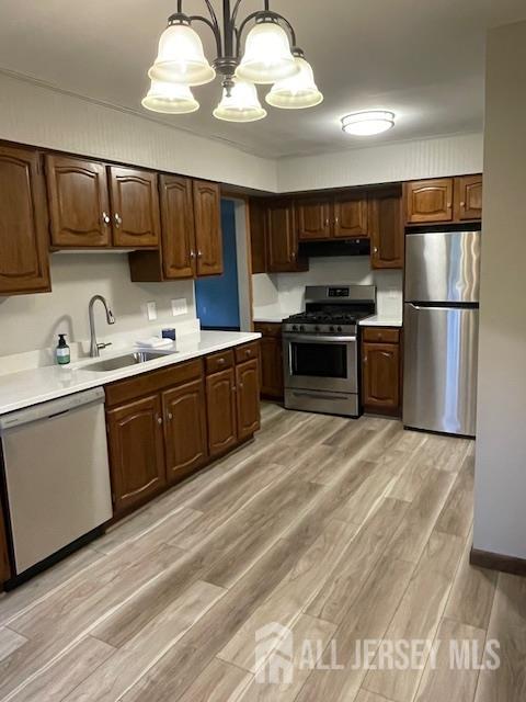 55 Murdock Street Fords, NJ 08863 - Photo 4 of 42 a kitchen with stainless steel appliances granite countertop a sink a stove a refrigerator cabinets and a center island