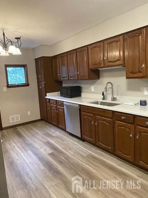 55 Murdock Street Fords, NJ 08863 - Photo 5 of 42 a kitchen with stainless steel appliances granite countertop a sink dishwasher stove and cabinets with wooden floor