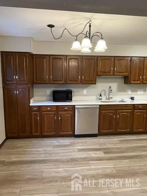 55 Murdock Street Fords, NJ 08863 - Photo 6 of 42 a kitchen with kitchen island granite countertop a sink cabinets and stainless steel appliances