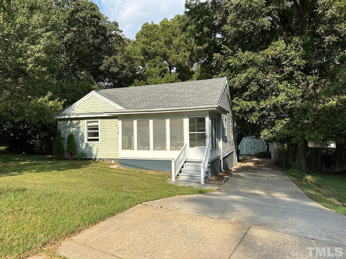 a house with a garden and trees