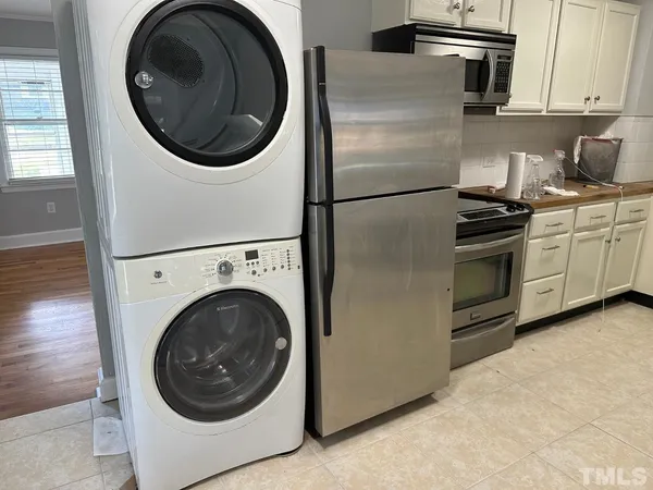 a kitchen with a washer and dryer
