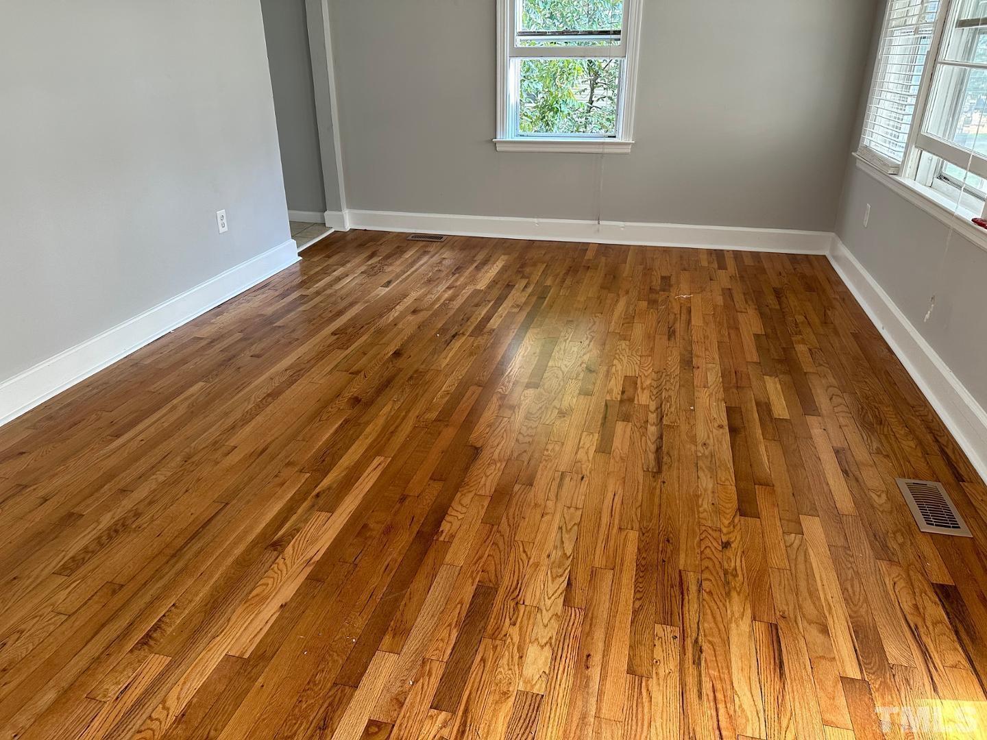 2617 Layden Street Raleigh, NC 27603 - Photo 3 of 9 an empty room with wooden floor
