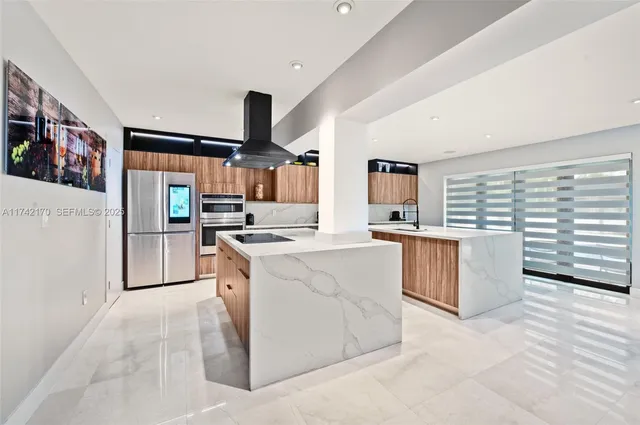 a living room with furniture and large windows
