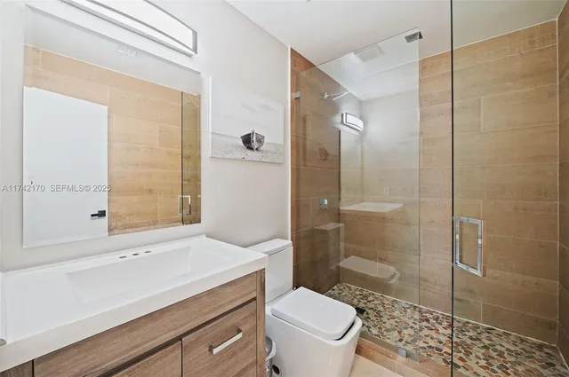 a bedroom with a bed and a table in it