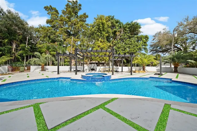 a view of a swimming pool with a patio