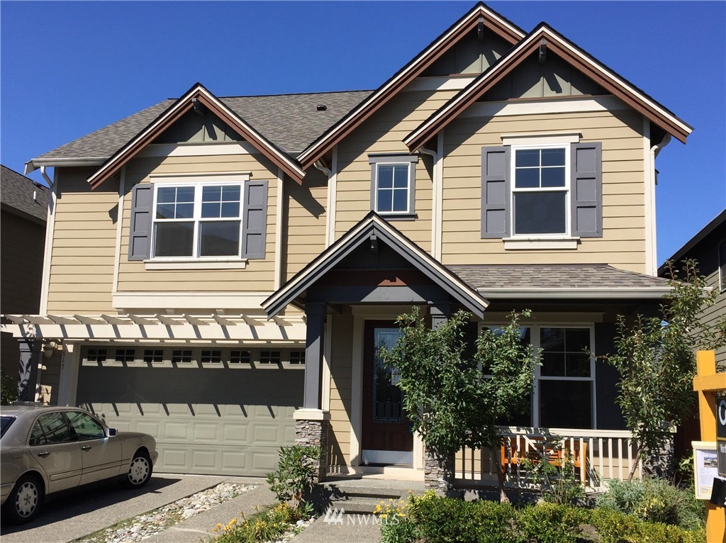 a front view of a house with a porch
