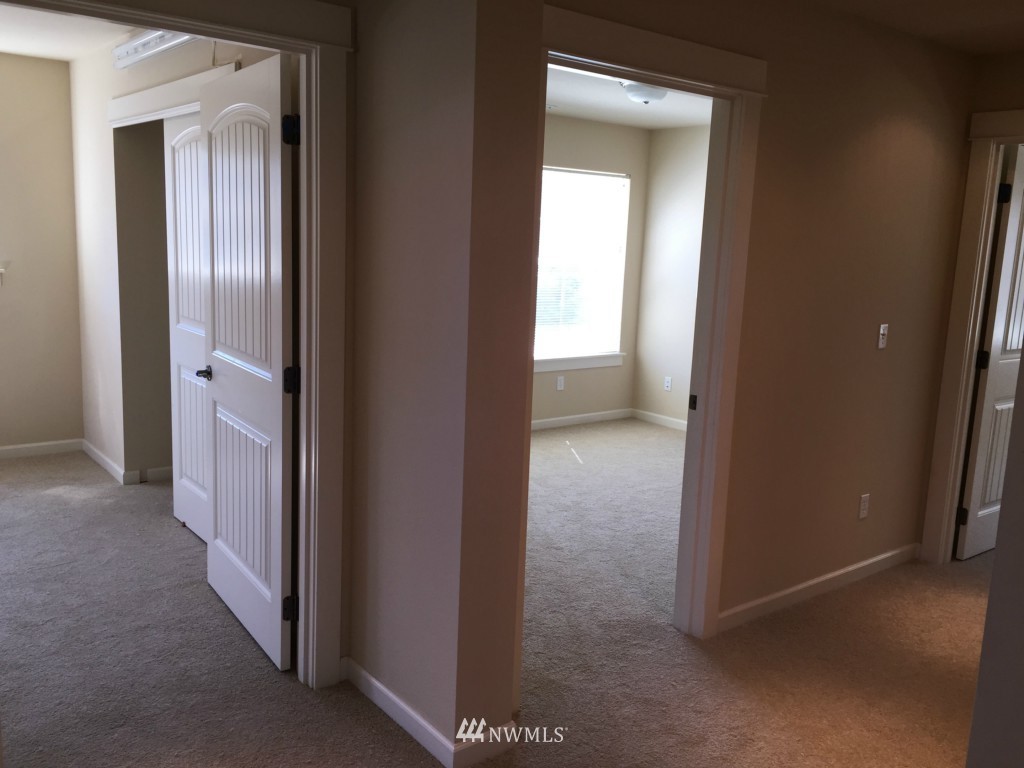 817 234th Place Southeast Bothell, WA 98021 - Photo 13 of 24 a view of a hallway to other door