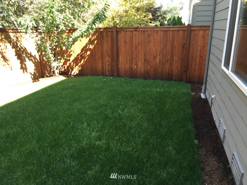 817 234th Place Southeast Bothell, WA 98021 - Photo 23 of 24 a view of backyard with wooden fence