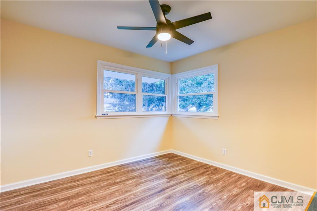 8 Halsey Road Kendall Park, NJ 08824 - Photo 11 of 30 a view of empty room with wooden floor