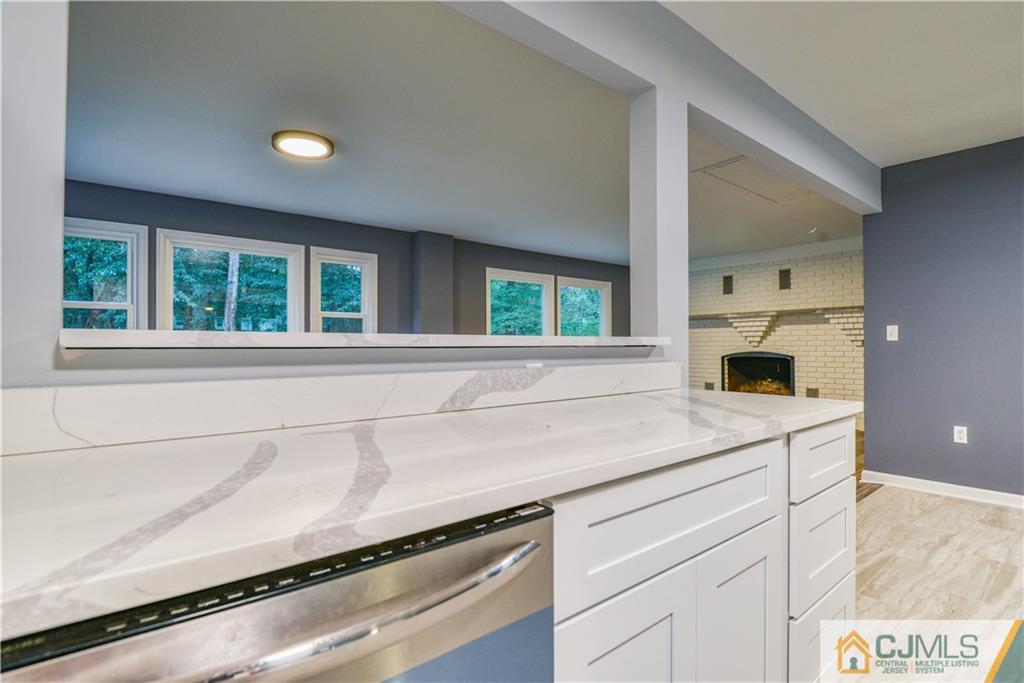 8 Halsey Road Kendall Park, NJ 08824 - Photo 17 of 30 a kitchen with a sink and a window