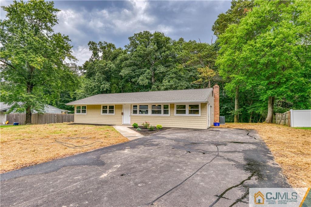8 Halsey Road Kendall Park, NJ 08824 - Photo 2 of 30 a front view of a house with a garden