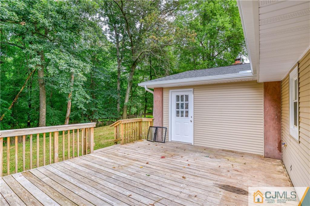 8 Halsey Road Kendall Park, NJ 08824 - Photo 28 of 30 a view of a wooden deck