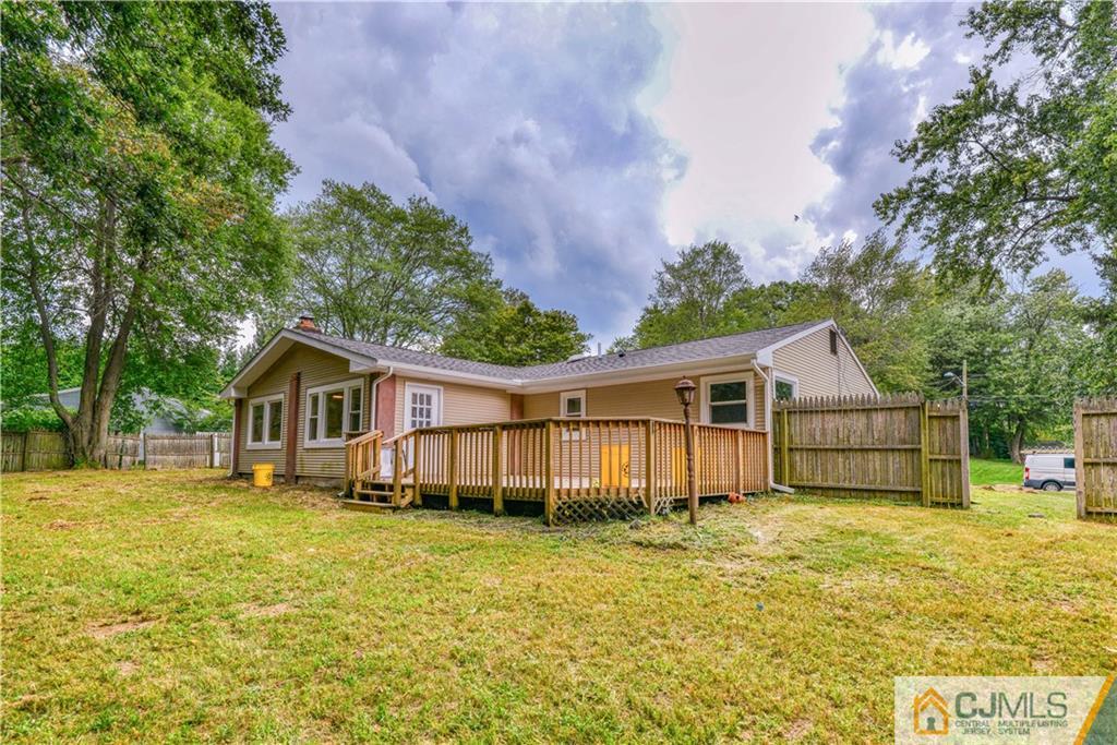 8 Halsey Road Kendall Park, NJ 08824 - Photo 29 of 30 a view of a house with a big yard and large trees