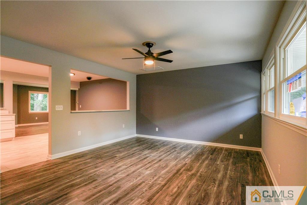 8 Halsey Road Kendall Park, NJ 08824 - Photo 3 of 30 wooden floor in an empty room with a window