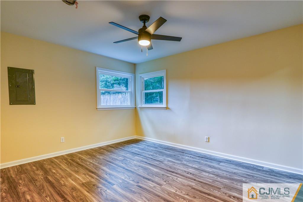 8 Halsey Road Kendall Park, NJ 08824 - Photo 8 of 30 a view of empty room with wooden floor