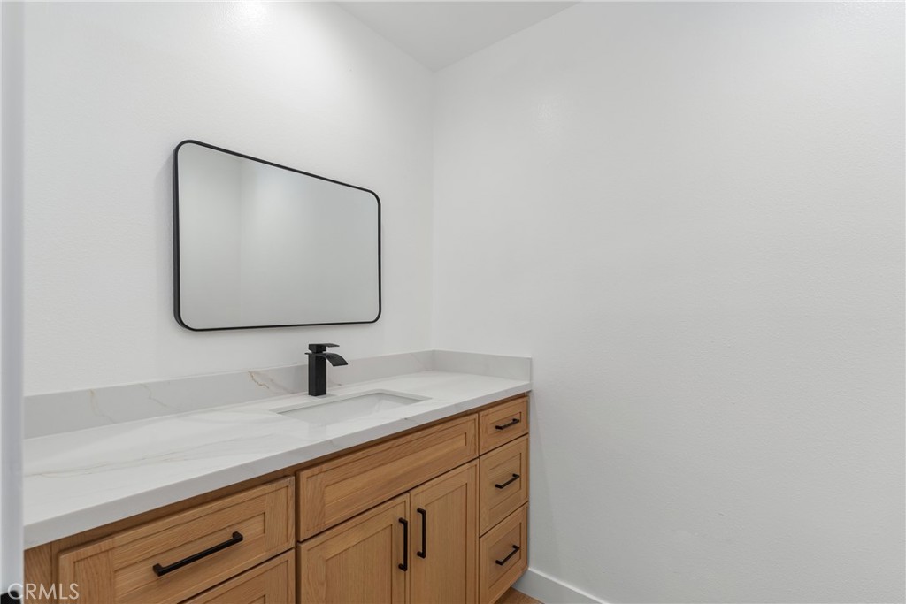 15 Hilltop Circle Rancho Palos Verdes, CA 90275 - Photo 11 of 40 a bathroom with a sink and a mirror