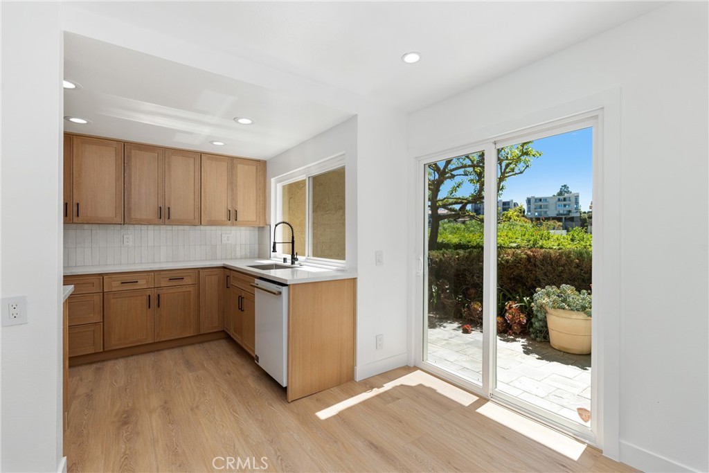 15 Hilltop Circle Rancho Palos Verdes, CA 90275 - Photo 12 of 40 a kitchen with a refrigerator and a sink