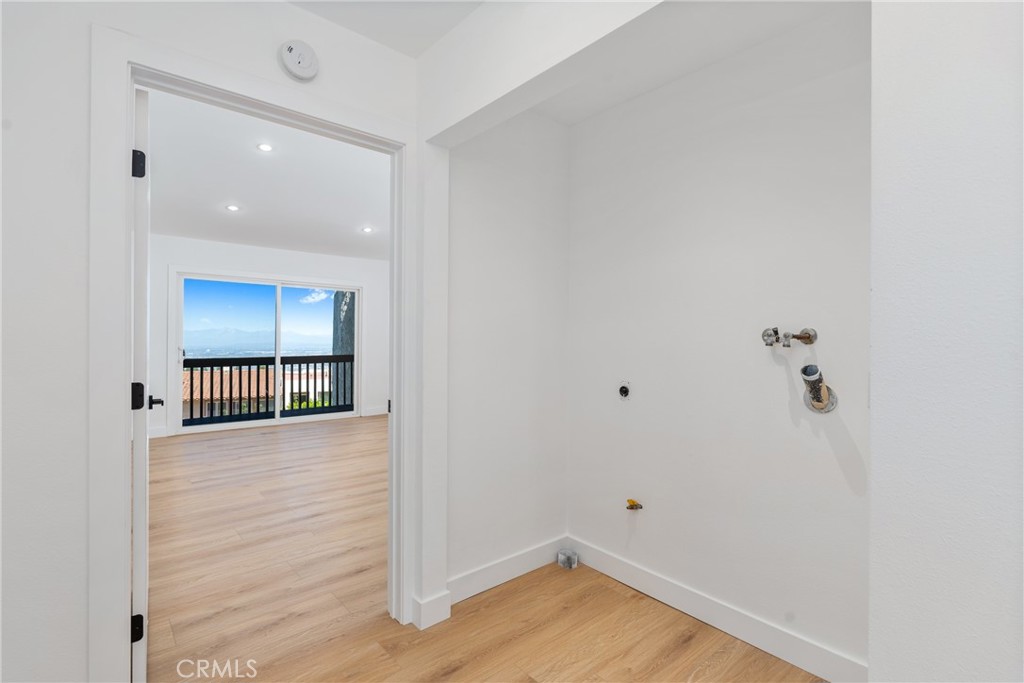 15 Hilltop Circle Rancho Palos Verdes, CA 90275 - Photo 31 of 40 a view of a hallway with wooden floor