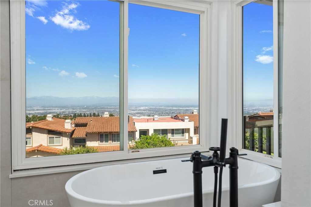 15 Hilltop Circle Rancho Palos Verdes, CA 90275 - Photo 37 of 40 a view of a bathroom with a tub and window